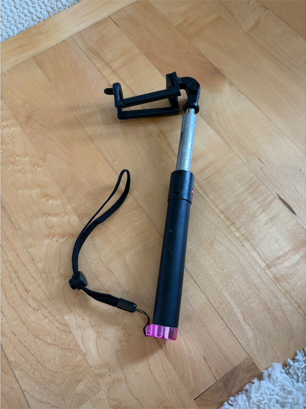 Compact Black Selfie Stick with Pink Accent